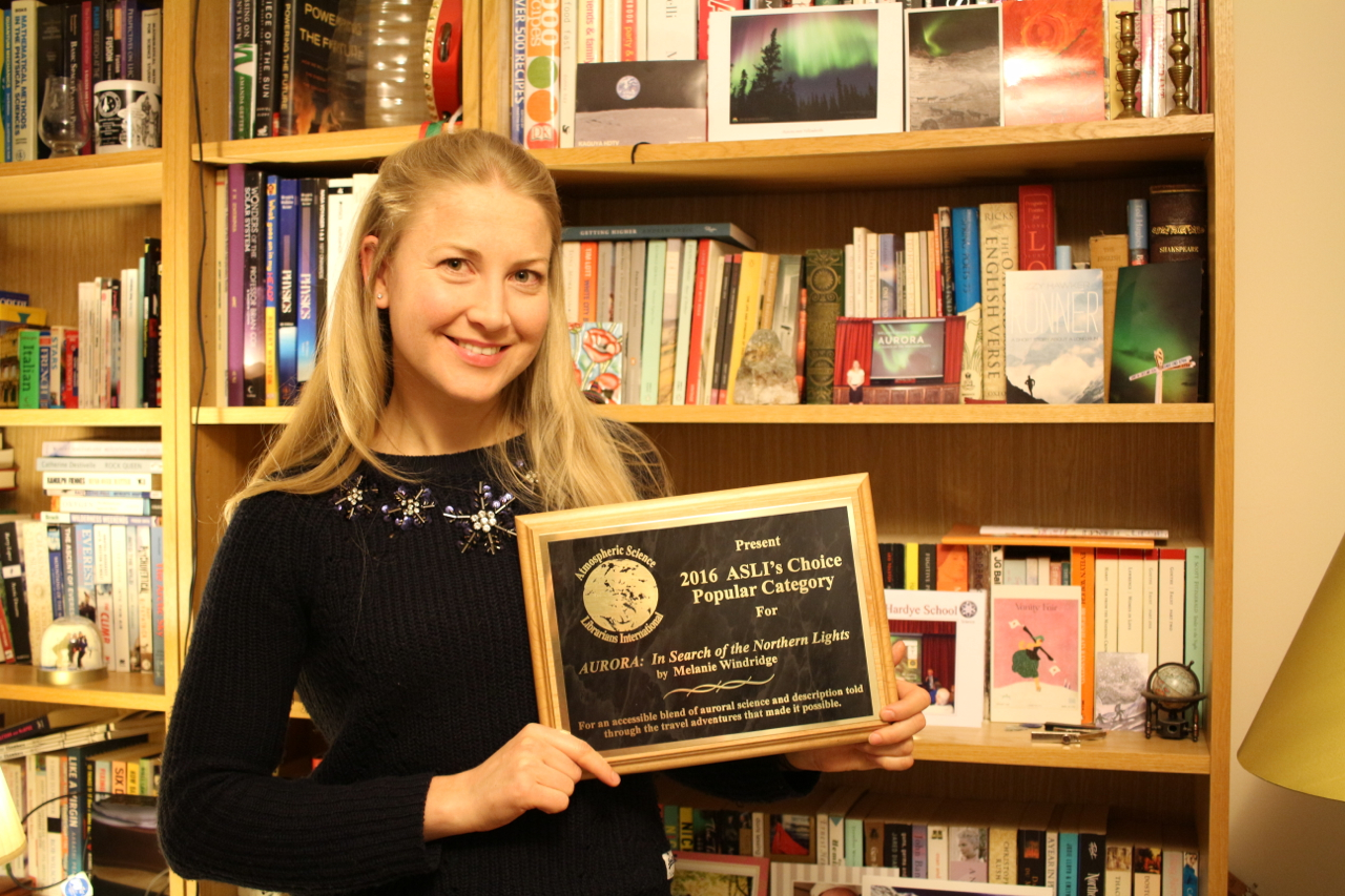 Me holding my ASLI award plaque.