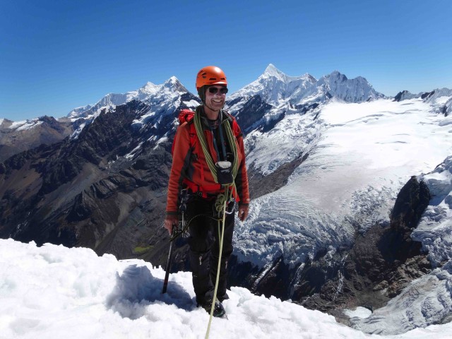 Dave on the summit of Mapiraju. Montains in the background are Chinchey (right) and Pucaranra (left).  The glacier and ice fall we could see from our camp are also in view.