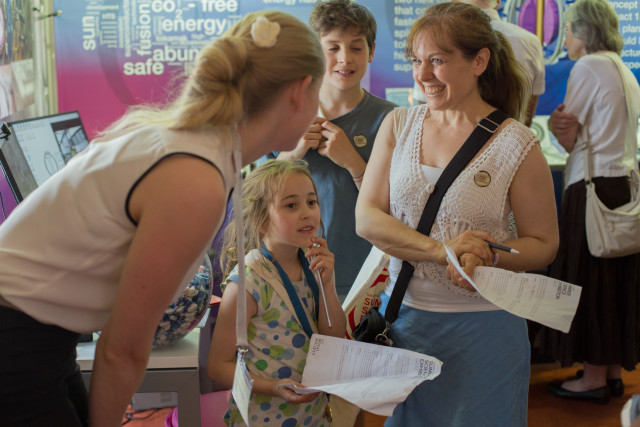 Talking to a family about fusion energy at the Royal Society Summer Exhibition 2015.