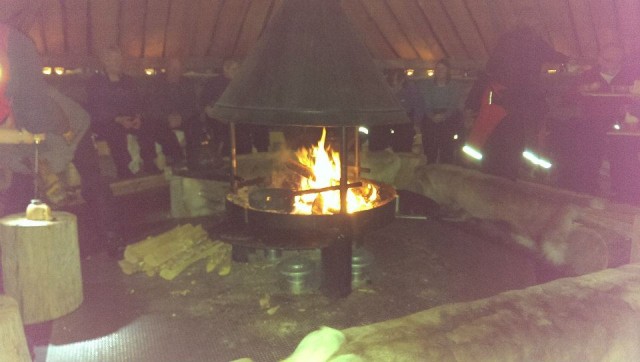 Sitting around the fire drinking (cheesy!) coffee in Lapland.