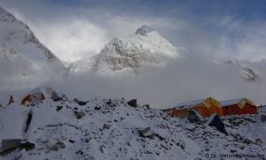 Clouds at Everest Base Camp clear to show the peak of Nuptse. Dr. Melanie Windridge