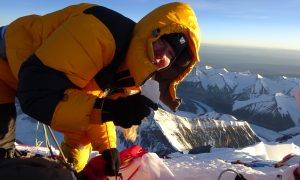 Melanie takes a snow sample on the summit of Everest